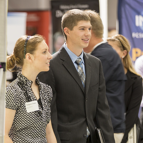 Two students in business attire